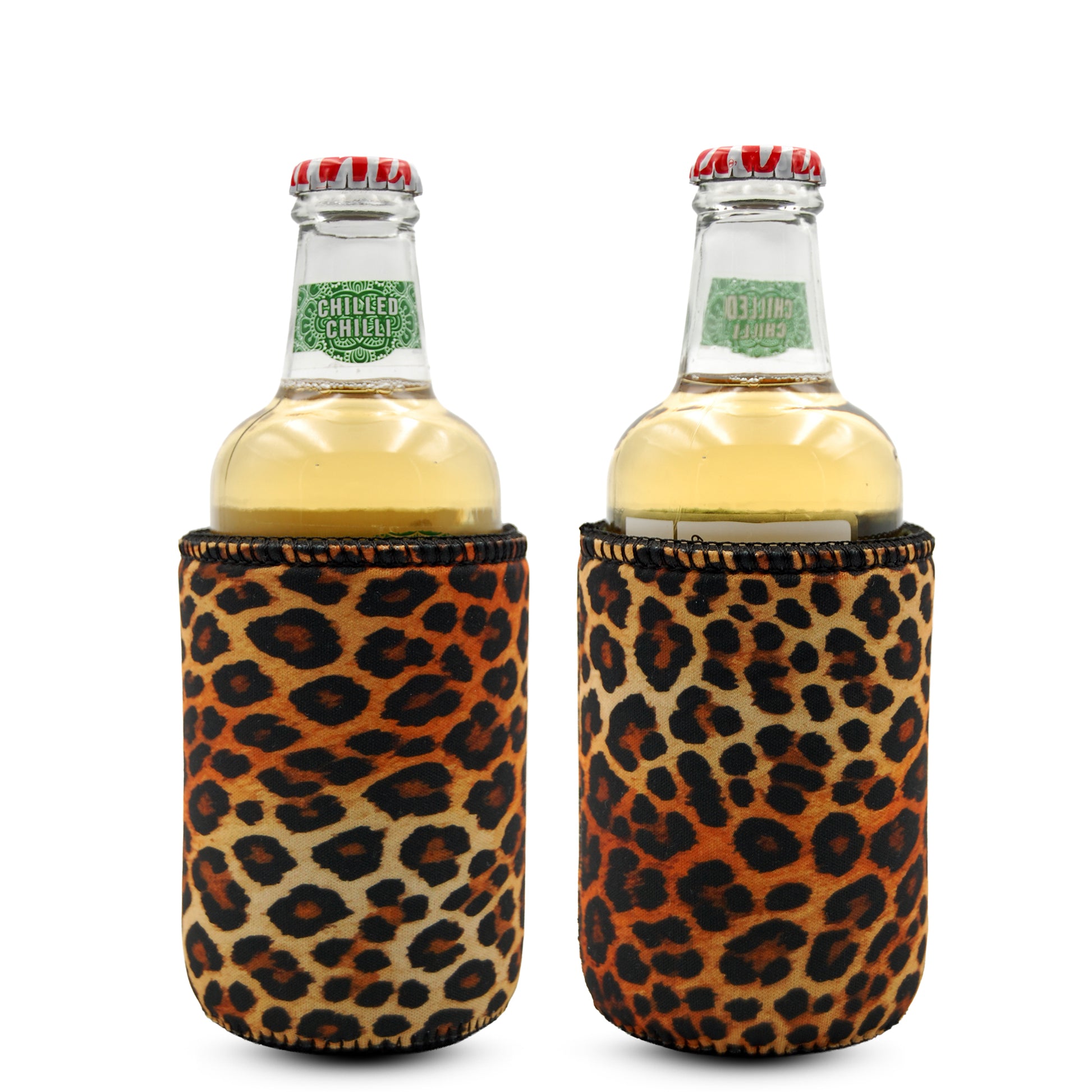 Two glass beverage bottles with red caps wrapped in leopard print insulated stubby coolers.