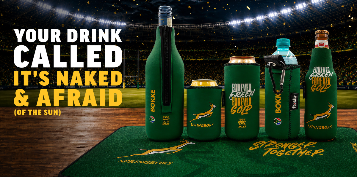 A set of green Springboks-branded drink accessories displayed on a stadium field mat in front of a stadium background. The set includes a bottle sleeve, a can cooler, a tumbler sleeve with a carabiner, and a tall bottle sleeve, all in dark green with yellow and white Springboks branding.